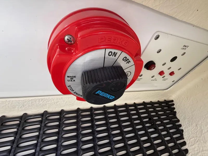 Slide: The Image of Red Perko battery switch on a 2009 Formula 240 Bowrider boat control panel. - 24