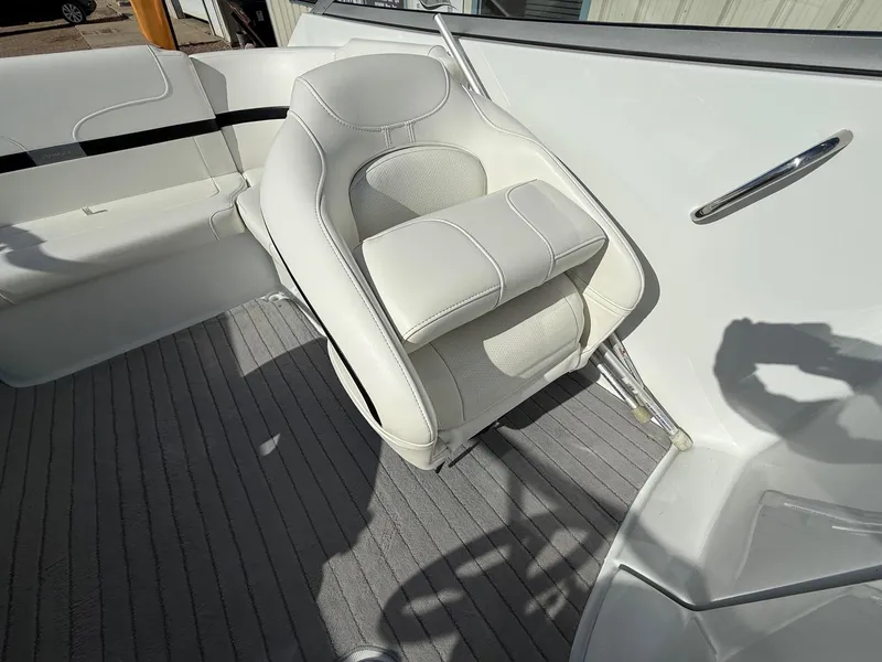 Slide: The Image of 2009 Formula 240 Bowrider interior with white seating and gray carpet. - 26