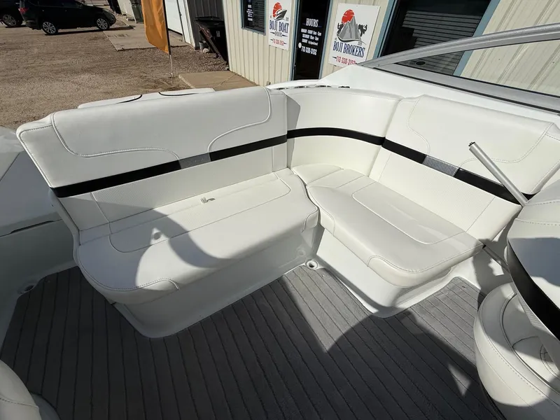 Slide: The Image of 2009 Formula 240 Bowrider interior with white seating and gray flooring. - 27