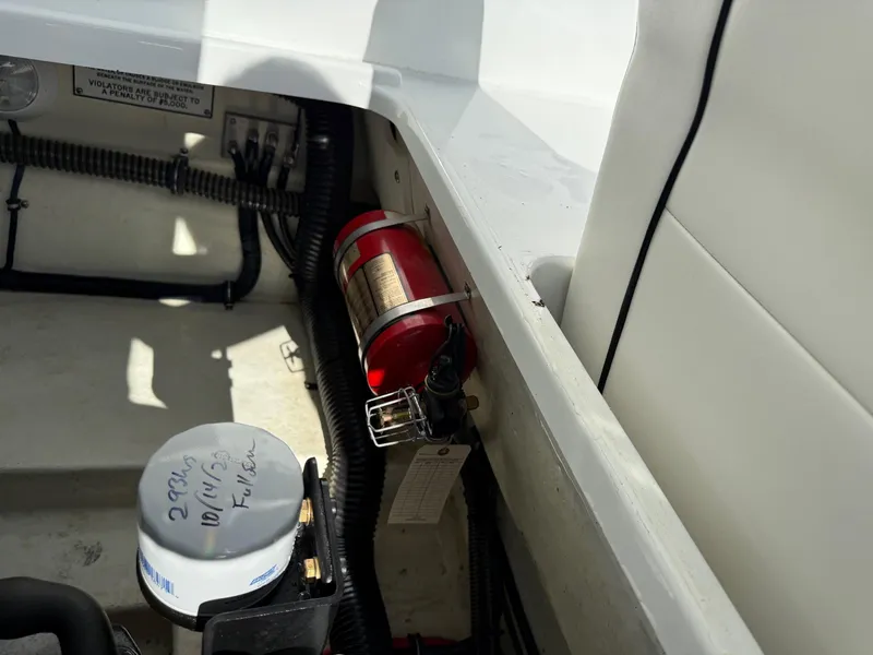 Slide: The Image of 2009 Formula 240 Bowrider interior with fire extinguisher and engine components. - 31