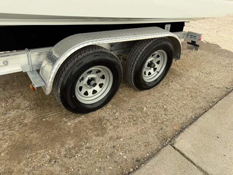 Slide: The Image of Trailer wheels for 2009 Formula 240 Bowrider on sandy ground. - 34
