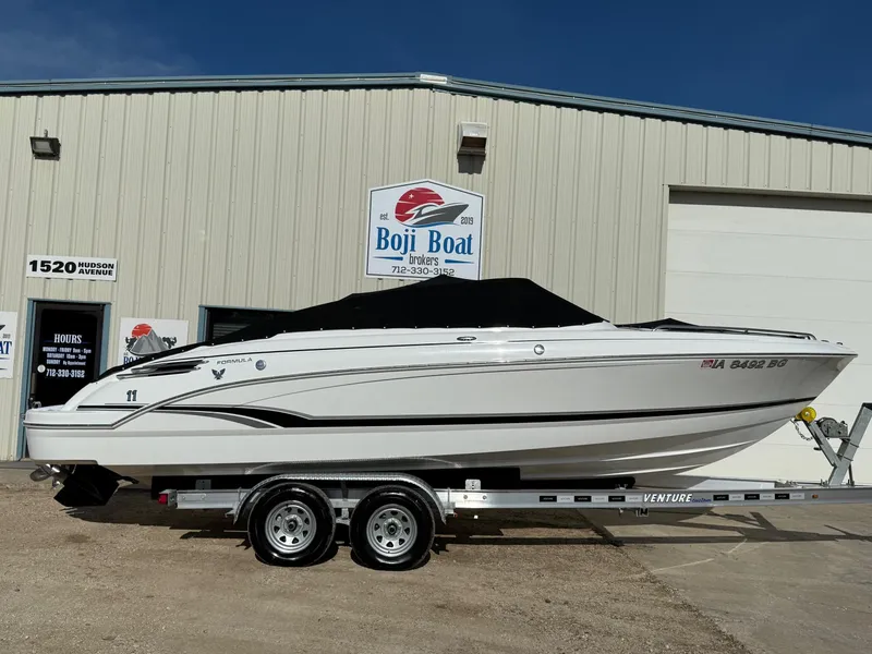Slide: The Image of 2009 Formula 240 Bowrider boat on trailer outside Boji Boat Brokers building. - 36