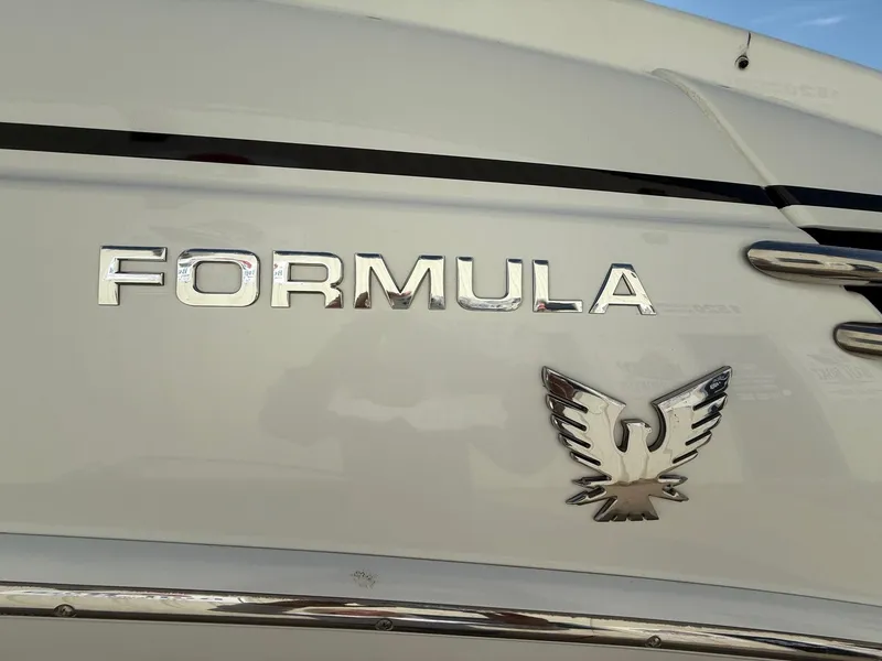 Slide: The Image of 2009 Formula 240 Bowrider boat emblem with eagle logo on white surface. - 7
