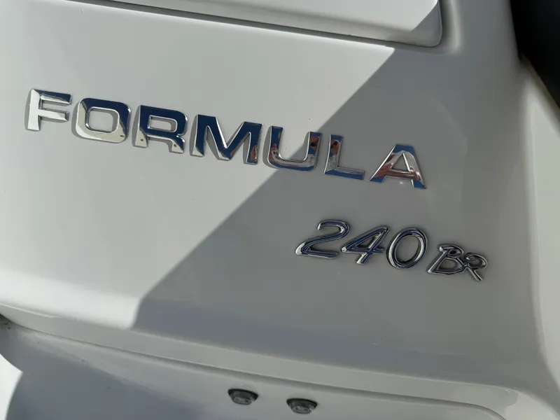 Slide: The Image of 2009 Formula 240 Bowrider boat emblem in shiny chrome lettering. - 8