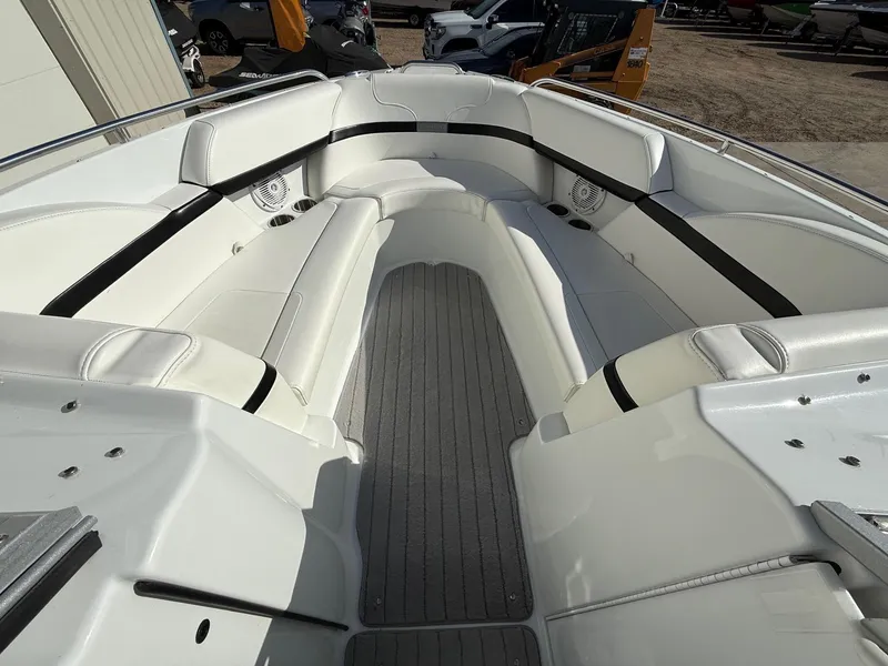 Slide: The Image of 2009 Formula 240 Bowrider interior with white seating and gray flooring. - 9