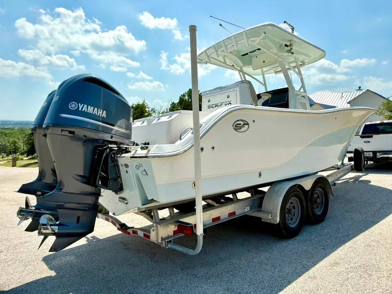 Slide: The Image of 2017 Sea Fox 288 Commander boat on trailer with Yamaha outboard motor, parked outdoors. - 14