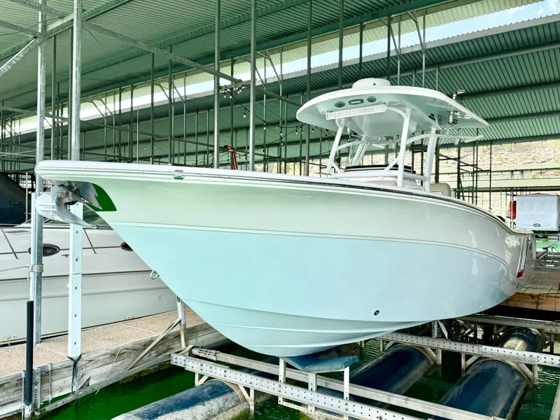 Slide: The Image of 2017 Sea Fox 288 Commander boat docked in a covered marina. - 18