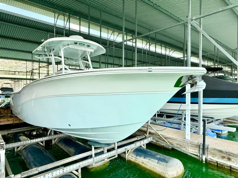 Slide: The Image of 2017 Sea Fox 288 Commander boat docked in a covered marina. - 19