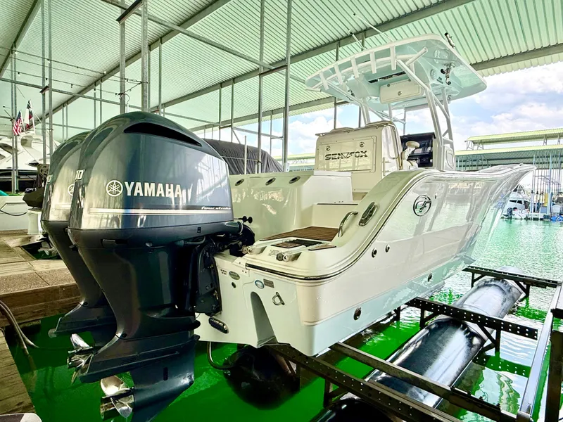 Slide: The Image of 2017 Sea Fox 288 Commander boat with Yamaha engines in a covered marina. - 20