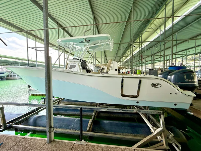 Slide: The Image of 2017 Sea Fox 288 Commander boat in a covered marina dock. - 23