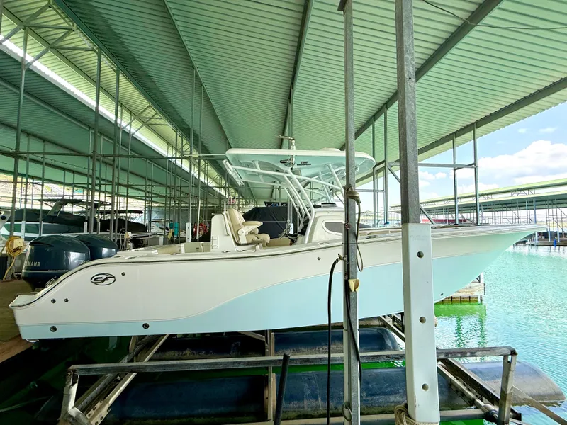 Slide: The Image of 2017 Sea Fox 288 Commander boat docked in a covered marina. - 24
