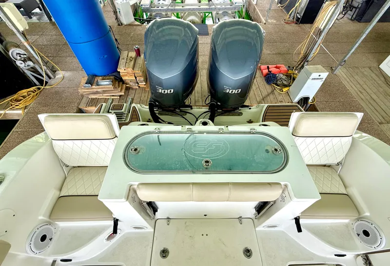 Slide: The Image of 2017 Sea Fox 288 Commander boat with dual 300 horsepower engines, spacious seating, and fishing amenities. - 26