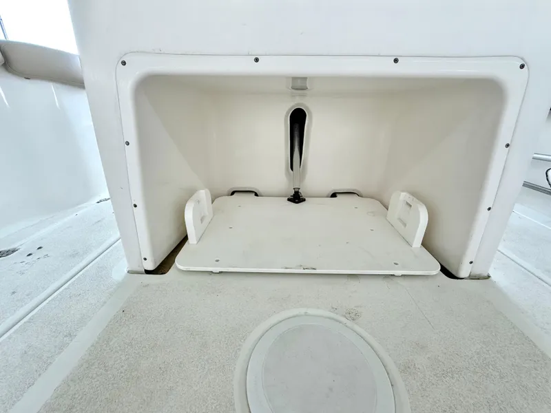 Slide: The Image of 2017 Sea Fox 288 Commander storage compartment, open and empty, with clean white interior. - 29