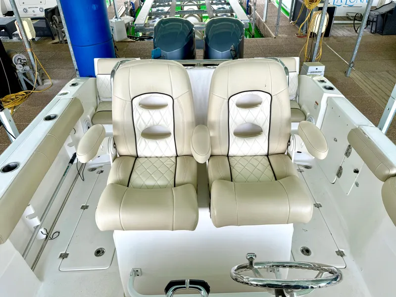 Slide: The Image of 2017 Sea Fox 288 Commander boat interior with dual beige captain's chairs. - 36