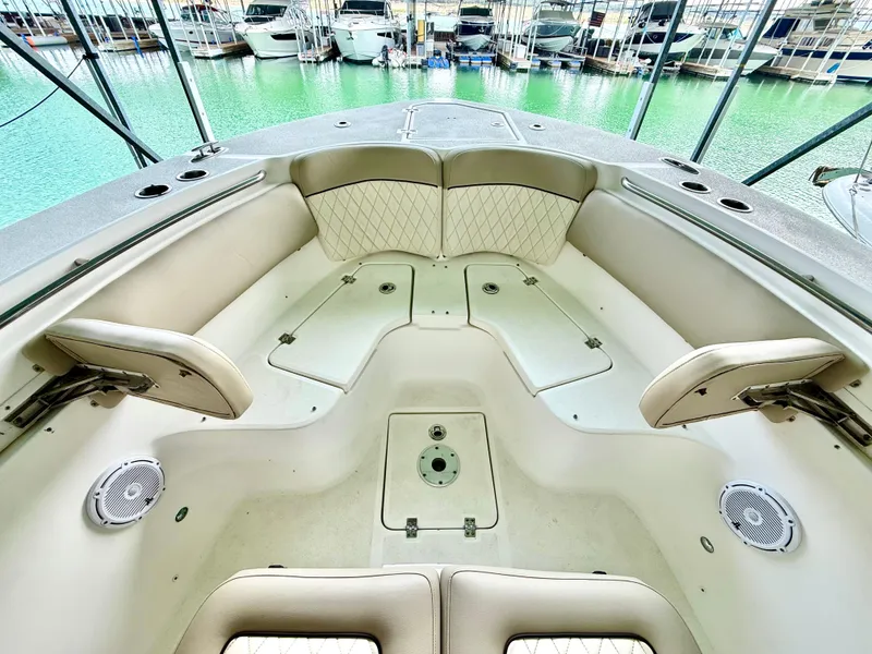 Slide: The Image of 2017 Sea Fox 288 Commander boat interior with spacious seating and storage, docked at marina. - 40