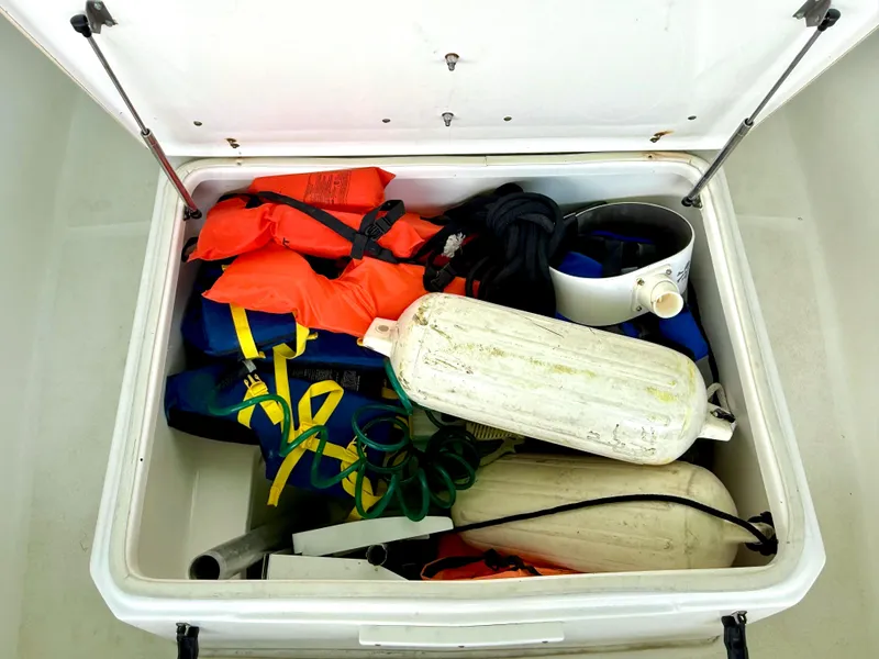 Slide: The Image of Storage compartment of 2017 Sea Fox 288 Commander with life jackets and boating equipment. - 41