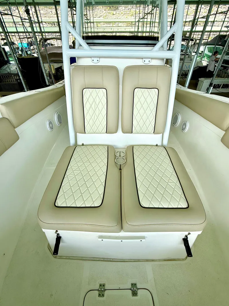 Slide: The Image of 2017 Sea Fox 288 Commander boat with beige cushioned seating and diamond stitching. - 42