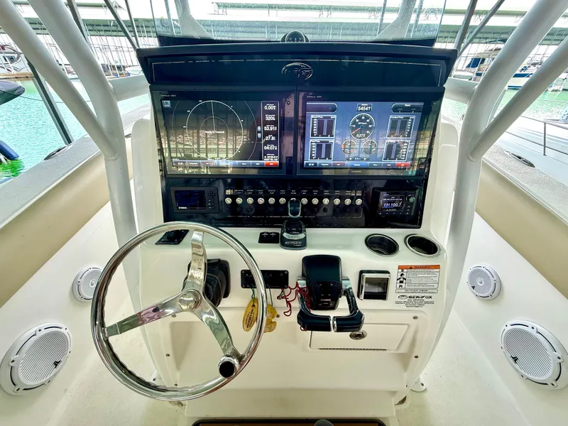 Slide: The Image of 2017 Sea Fox 288 Commander helm with advanced navigation displays and controls. - 47