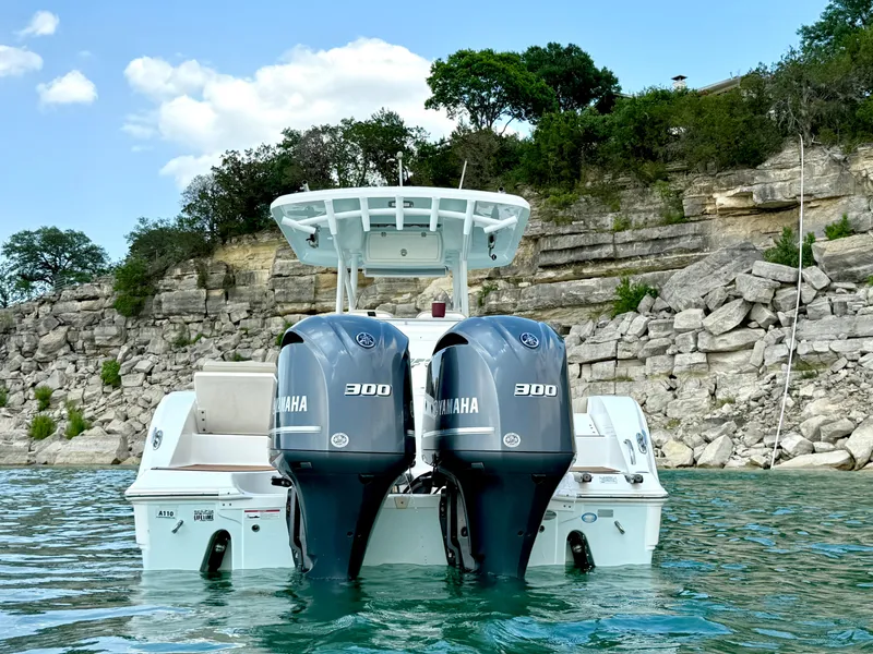 Slide: The Image of 2017 Sea Fox 288 Commander boat with twin Yamaha 300 engines on a scenic lake. - 8
