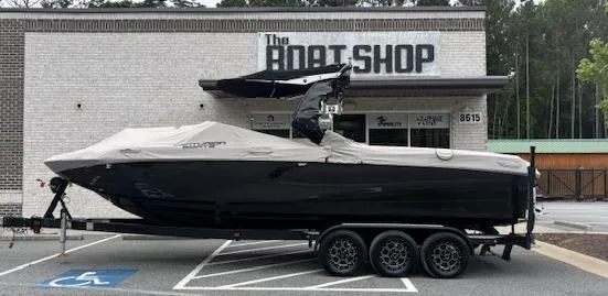 Slide: The Image of 2019 Centurion Fi 25 boat on trailer outside The Boat Shop. - 1
