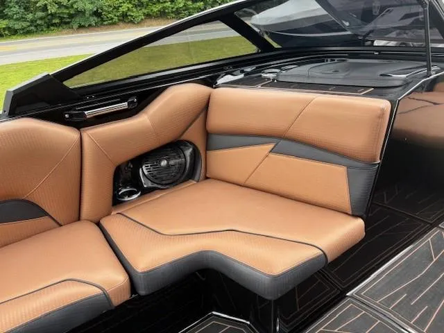 Slide: The Image of Luxurious interior of 2019 Centurion Fi 25 boat with tan and black seating. - 6