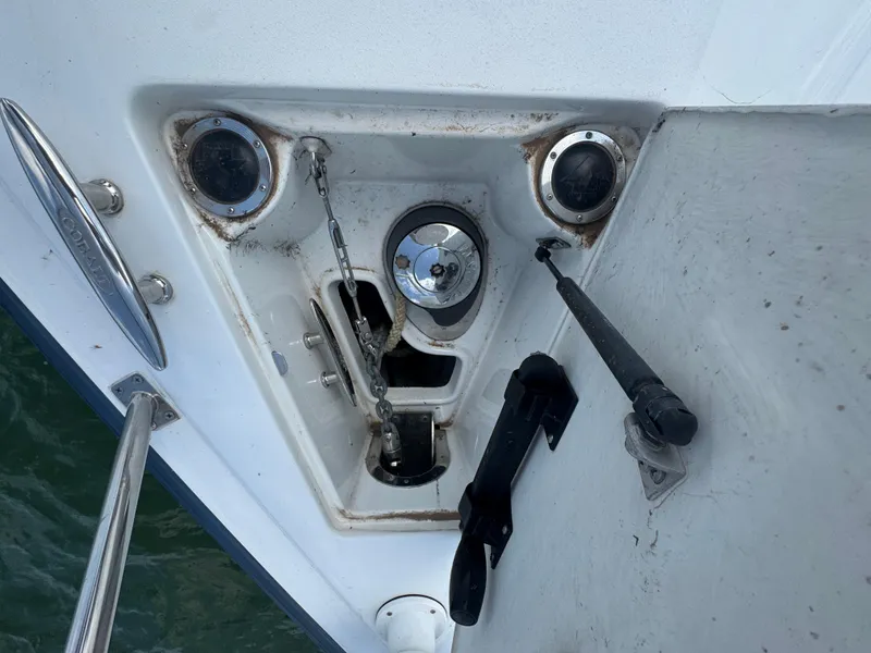 Slide: The Image of Anchor compartment of a 2005 Cobalt 360 boat with visible chain and fittings. - 10