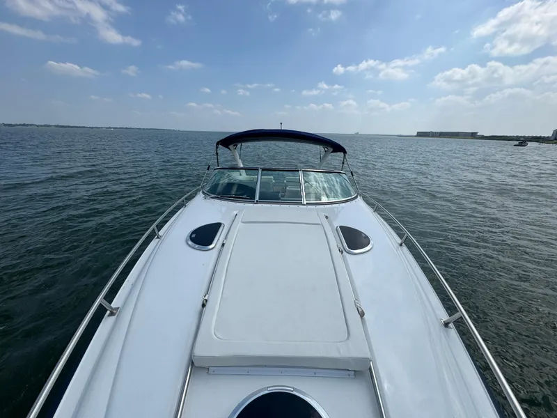 Slide: The Image of 2005 Cobalt 360 boat on open water under a clear blue sky. - 11