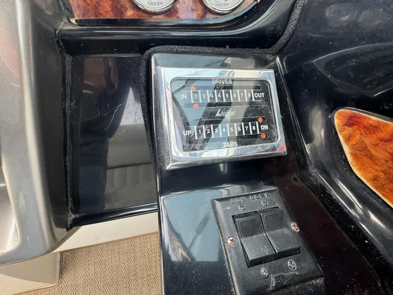 Slide: The Image of Control panel of a 2005 Cobalt 360 boat with drive and tab indicators. - 17