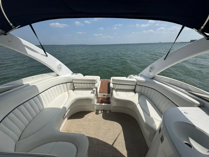Slide: The Image of Luxury Cobalt 360 boat interior with white seating, overlooking calm ocean waters. - 19