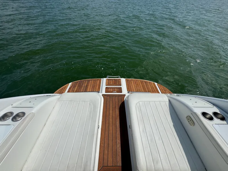 Slide: The Image of Rear view of 2005 Cobalt 360 boat with teak deck and white seating. - 24