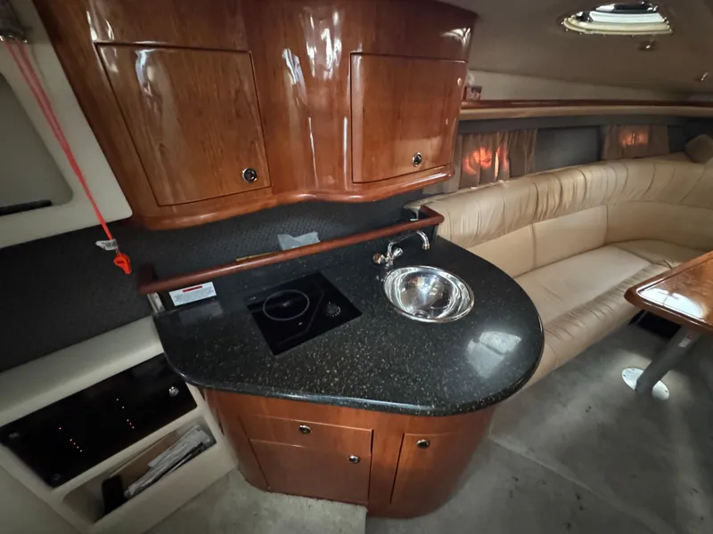 Slide: The Image of Luxurious 2005 Cobalt 360 yacht interior with kitchenette and seating area. - 26