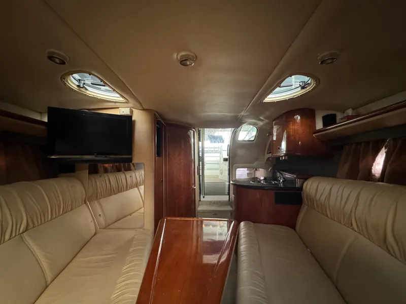 Slide: The Image of Luxurious interior of a 2005 Cobalt 360 yacht with plush seating and modern amenities. - 28