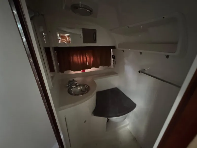 Slide: The Image of 2005 Cobalt 360 boat interior bathroom with sink, countertop, and shelves. - 30