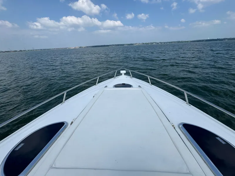 Slide: The Image of Bow view of 2005 Cobalt 360 boat on open water under blue sky. - 7