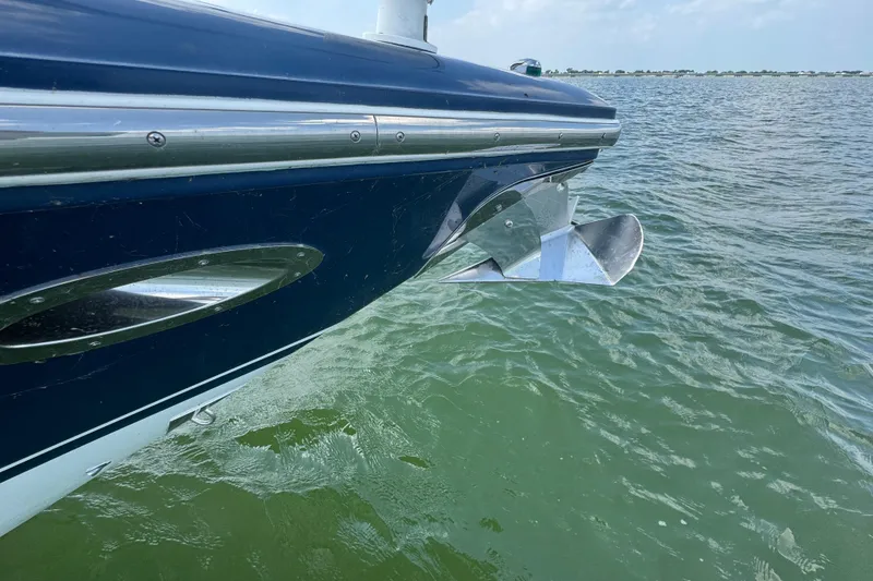 Slide: The Image of 2005 Cobalt 360 boat on water, showing sleek hull and propeller. - 9