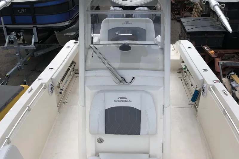 Slide: The Image of 2021 Cobia 240 CC boat interior with center console and seating. - 5