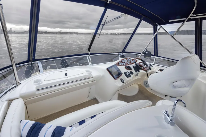 Slide: The Image of 2008 Meridian 391 Sedan helm with panoramic water view, featuring modern controls and seating. - 11