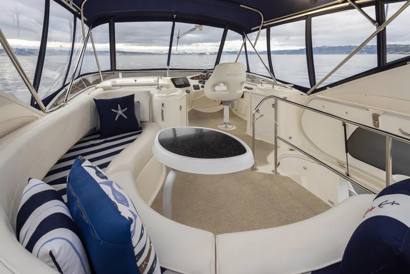 Slide: The Image of 2008 Meridian 391 Sedan yacht interior with plush seating and ocean view. - 15