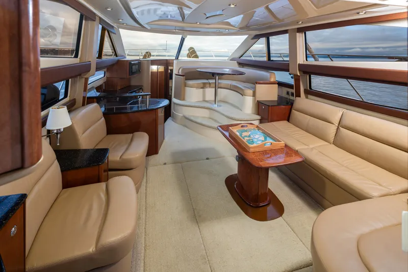 Slide: The Image of Luxurious interior of a 2008 Meridian 391 Sedan yacht with elegant seating and panoramic windows. - 16