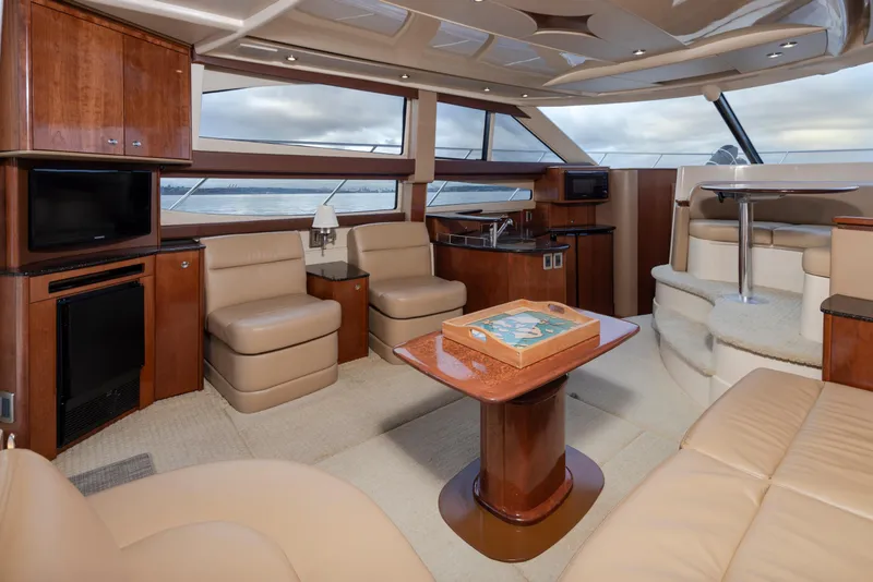 Slide: The Image of Luxurious interior of a 2008 Meridian 391 Sedan yacht with elegant seating and wood finishes. - 17