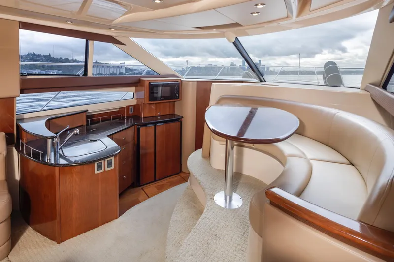 Slide: The Image of Luxurious interior of a 2008 Meridian 391 Sedan yacht with elegant seating and kitchenette. - 20