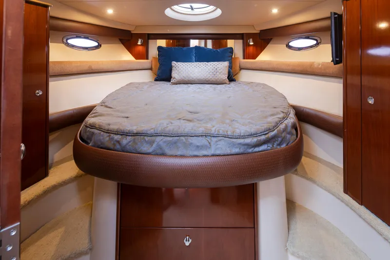 Slide: The Image of Luxurious cabin interior of a 2008 Meridian 391 Sedan yacht with a cozy bed. - 25