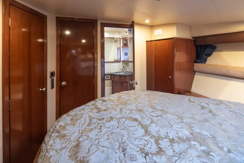 Slide: The Image of Luxurious interior of 2008 Meridian 391 Sedan yacht with elegant wood finishes. - 30
