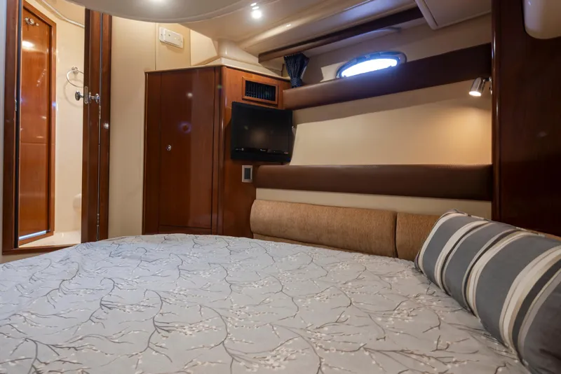 Slide: The Image of Luxurious cabin interior of 2008 Meridian 391 Sedan yacht with cozy bed and TV. - 34