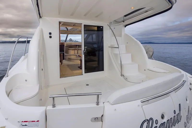 Slide: The Image of 2008 Meridian 391 Sedan yacht with open deck and cabin view on a cloudy day. - 35