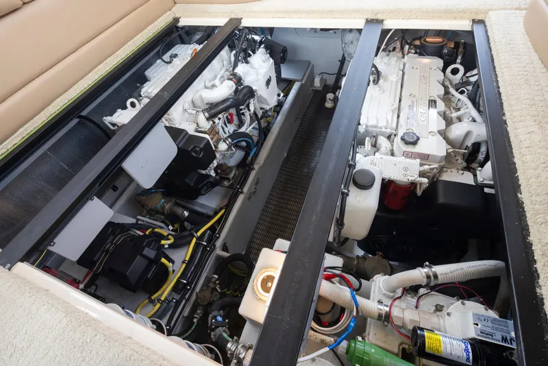 Slide: The Image of Engine compartment of a 2008 Meridian 391 Sedan boat, showcasing dual engines and mechanical components. - 37