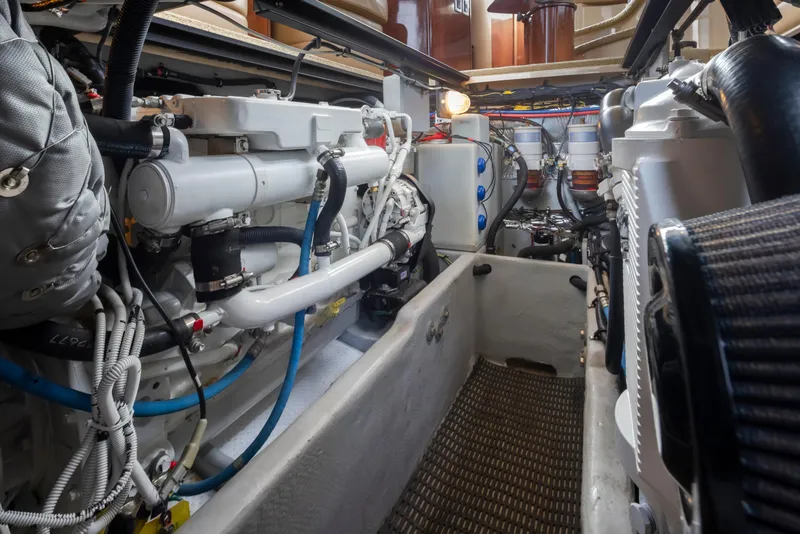 Slide: The Image of Engine room of 2008 Meridian 391 Sedan yacht, showcasing mechanical components and wiring. - 38