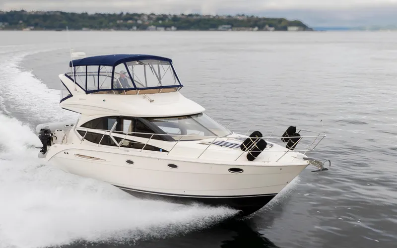 Slide: The Image of 2008 Meridian 391 Sedan cruising on open water, showcasing sleek design and performance. - 4