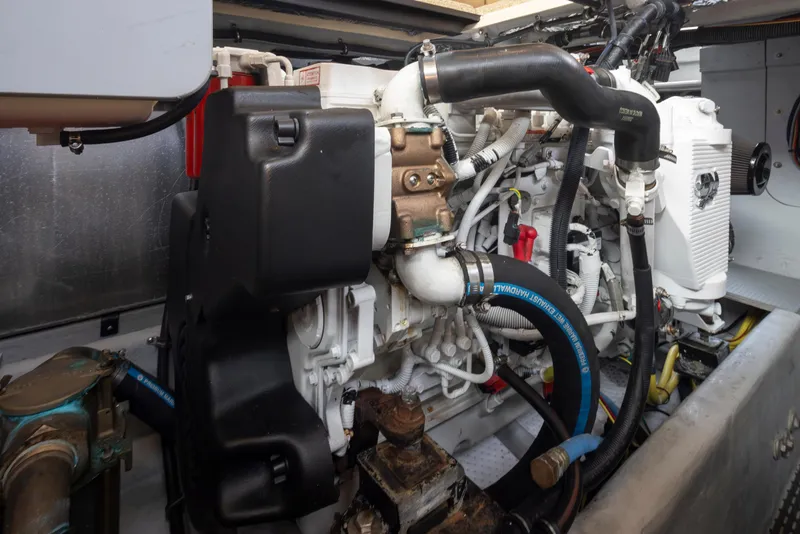 Slide: The Image of Engine compartment of a 2008 Meridian 391 Sedan boat, showcasing mechanical components and hoses. - 41