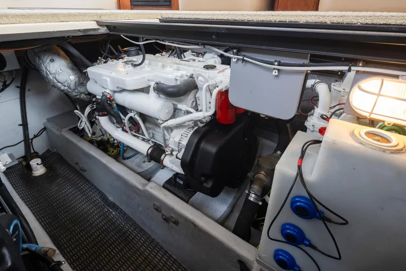 Slide: The Image of Engine compartment of a 2008 Meridian 391 Sedan boat, showcasing mechanical components and wiring. - 43